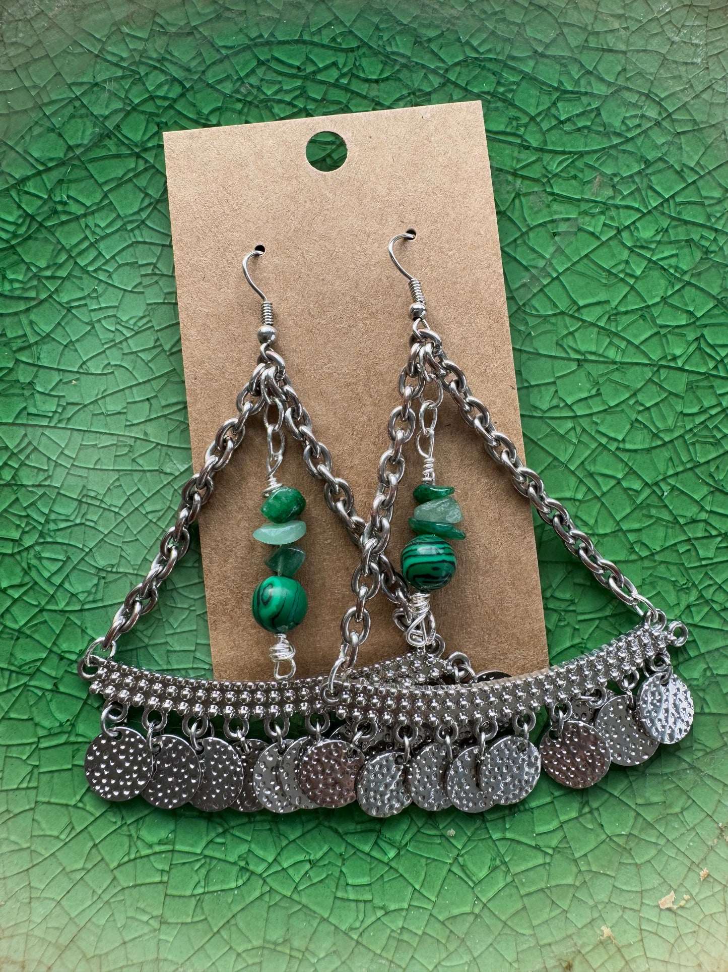 Large silver earrings with green center beads