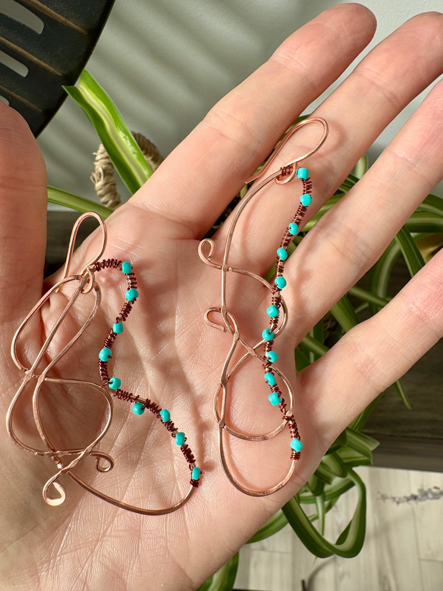 Abstract copper earrings with blue beads