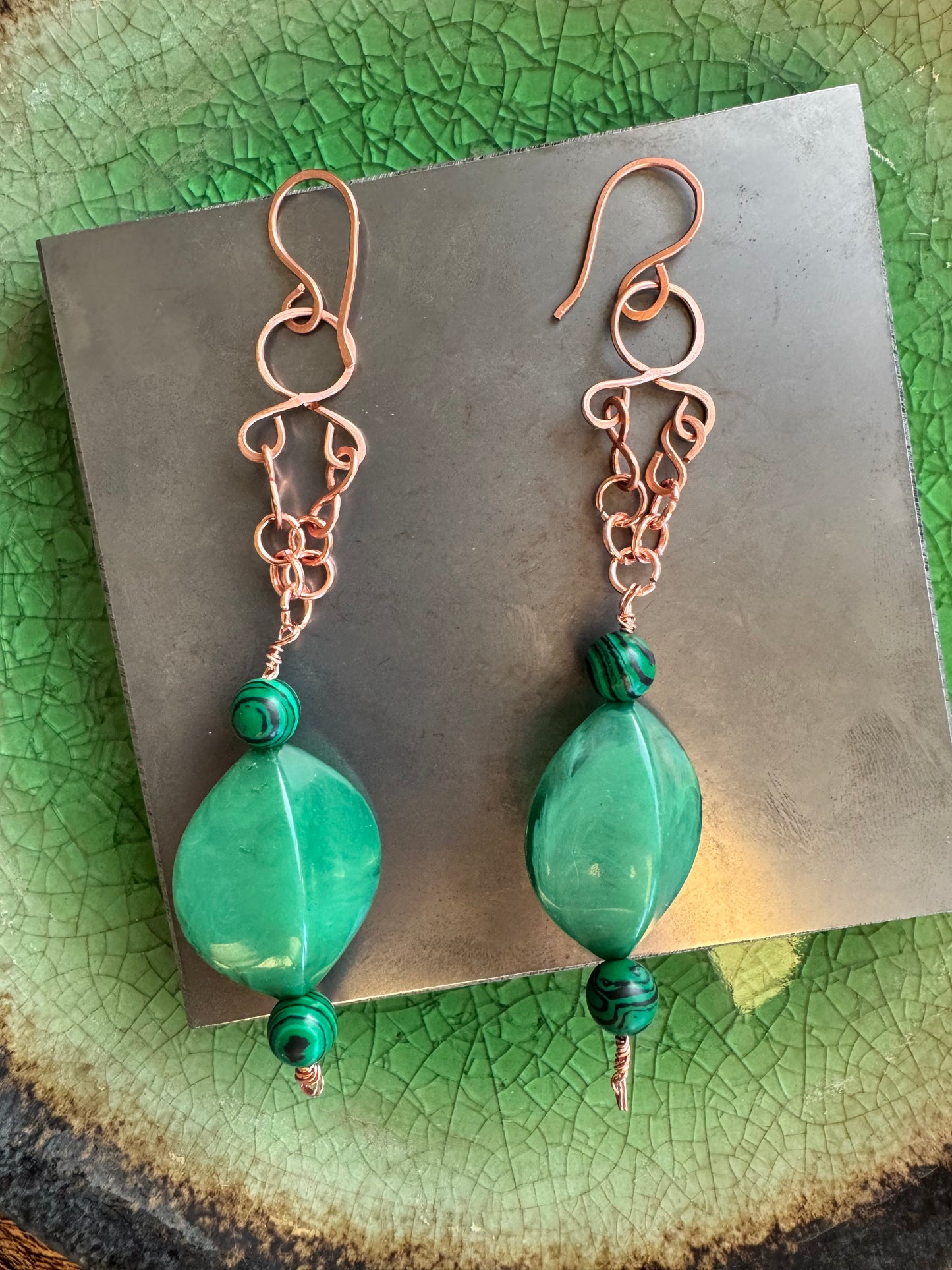 Copper dangle earrings with green beads
