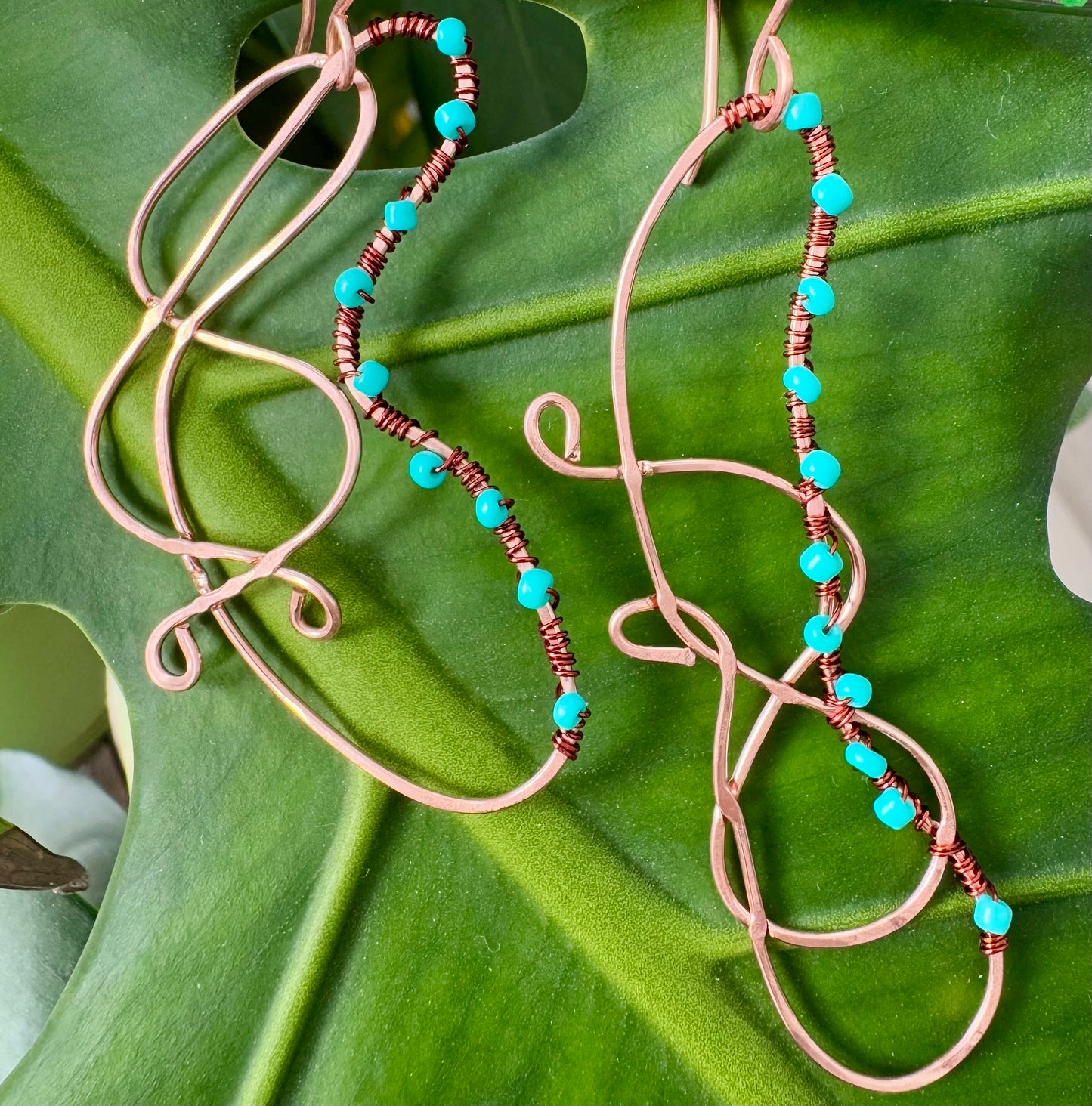 Abstract copper earrings with blue beads