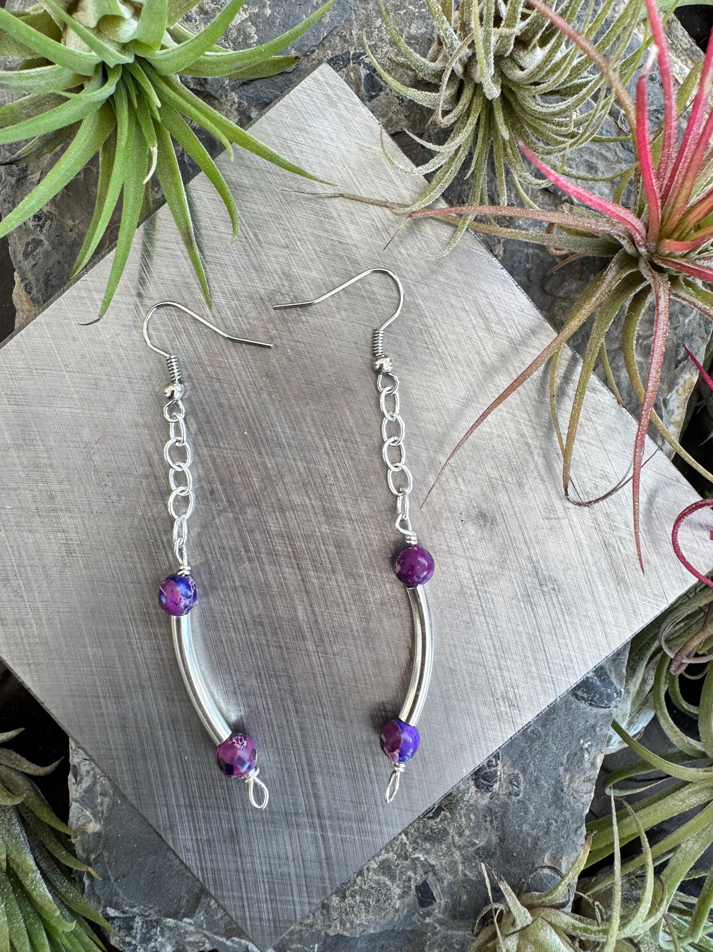 Silver earrings with curved and purple beads