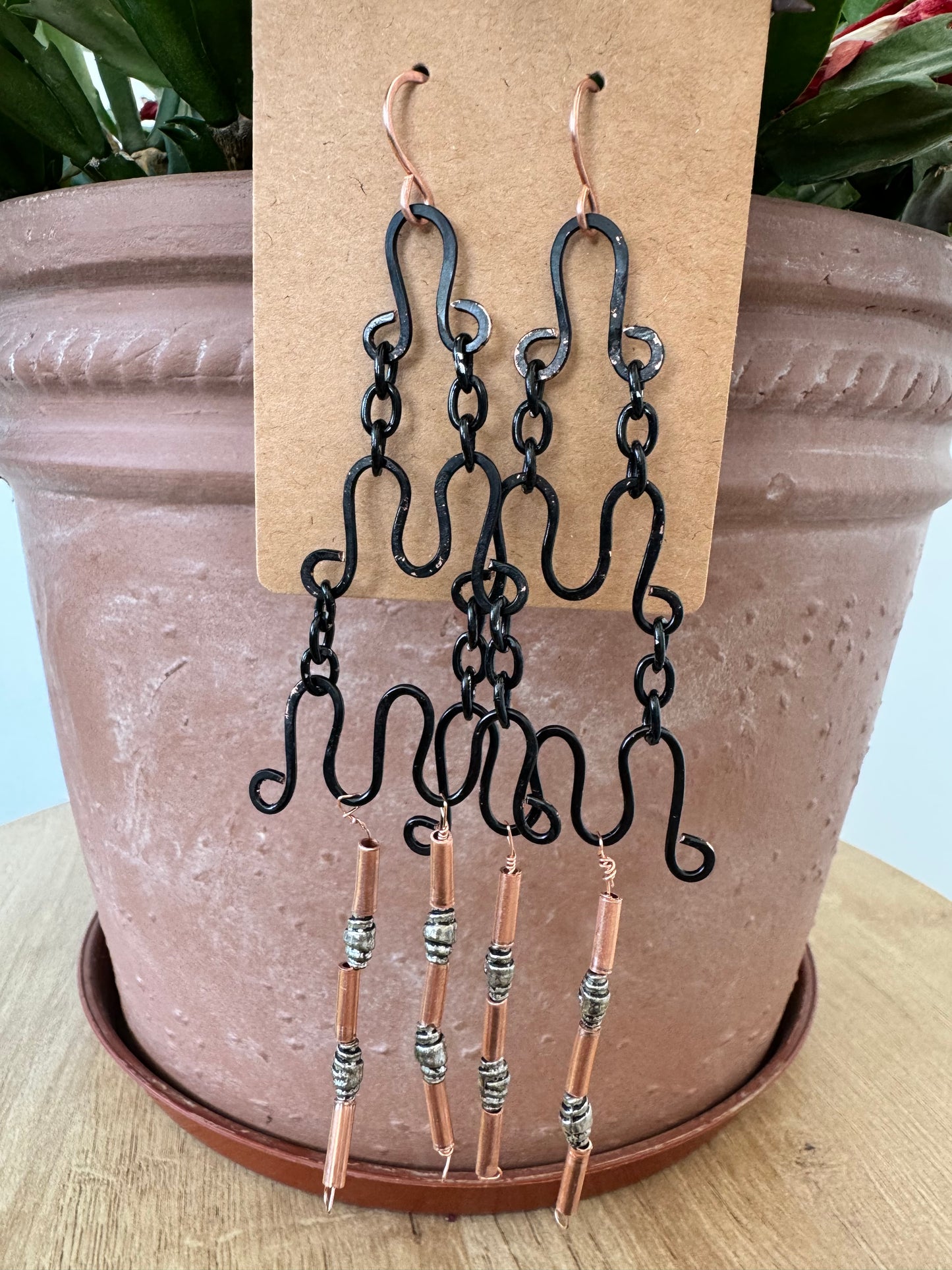 Tiered black wire earrings with copper beads